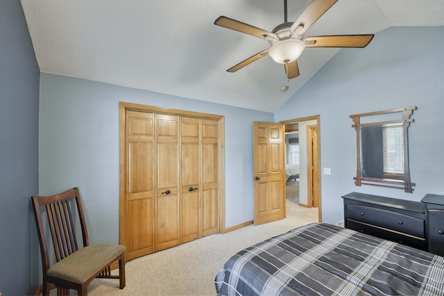 bedroom with carpet flooring, a closet, ceiling fan, and high vaulted ceiling