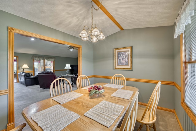 9169 W Farm Road 60, Willard, MO 65781 - carpeted dining area with a ceiling fan, a chandelier, vaulted ceiling, baseboards, and a textured ceiling