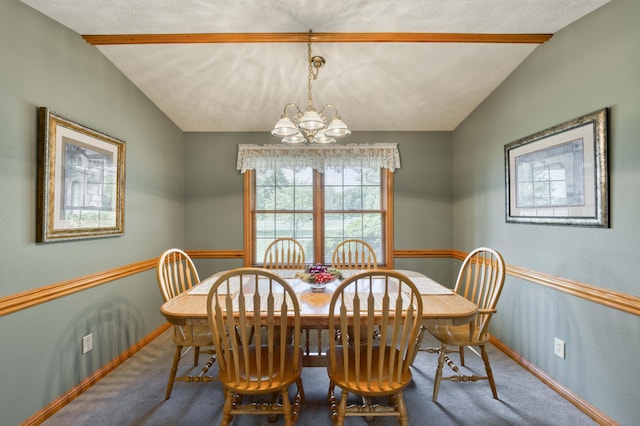 9169 W Farm Road 60, Willard, MO 65781 - dining room featuring carpet, a chandelier, baseboards, and vaulted ceiling