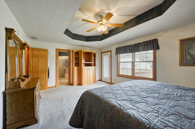 9169 W Farm Road 60, Willard, MO 65781 - bedroom featuring light carpet, baseboards, ceiling fan, a tray ceiling, and ensuite bath
