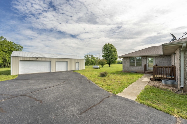 9169 W Farm Road 60, Willard, MO 65781 - view of grassy yard with a detached garage and an outdoor structure