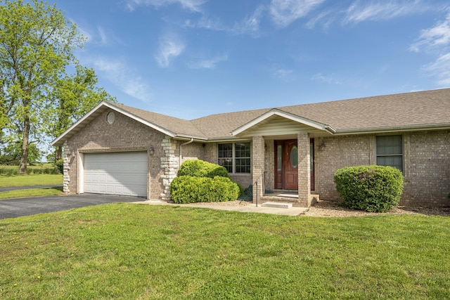 9169 W Farm Road 60, Willard, MO 65781 - single story home with brick siding, asphalt driveway, an attached garage, and a front yard