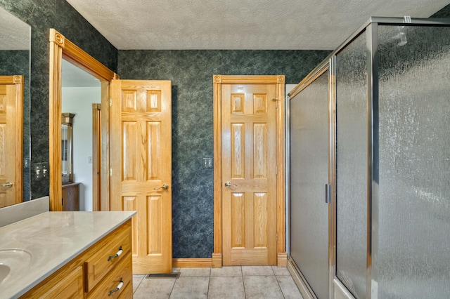 9169 W Farm Road 60, Willard, MO 65781 - full bath with a stall shower, tile patterned floors, a textured ceiling, wallpapered walls, and vanity