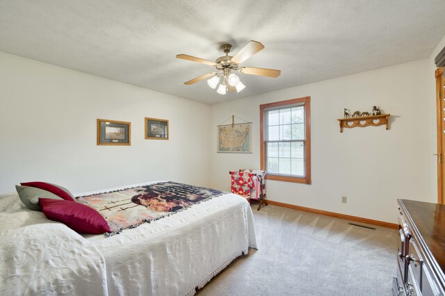 9169 W Farm Road 60, Willard, MO 65781 - bedroom with light carpet, baseboards, ceiling fan, and a textured ceiling