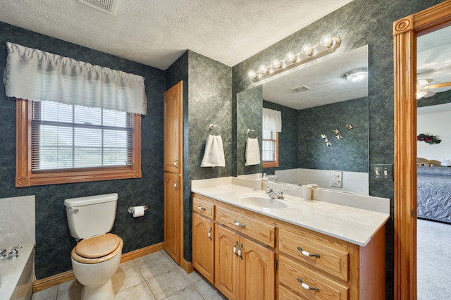 9169 W Farm Road 60, Willard, MO 65781 - bathroom featuring tile patterned flooring, toilet, a tub, a textured ceiling, and vanity