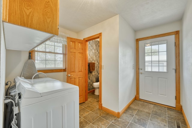 9169 W Farm Road 60, Willard, MO 65781 - washroom featuring washer / dryer, baseboards, and a textured ceiling