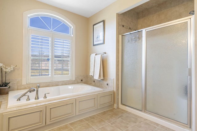 122 Arabian Way, Saddlebrooke, MO 65630 - full bathroom featuring a shower stall, a garden tub, and tile patterned flooring