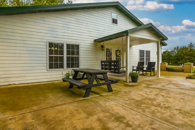 4216 Skyline Rd, Seymour, MO 65746 - rear view of house featuring a patio and outdoor dining space