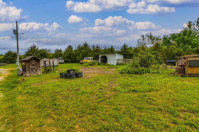 4216 Skyline Rd, Seymour, MO 65746 - view of yard featuring an outbuilding, a storage unit, and exterior structure