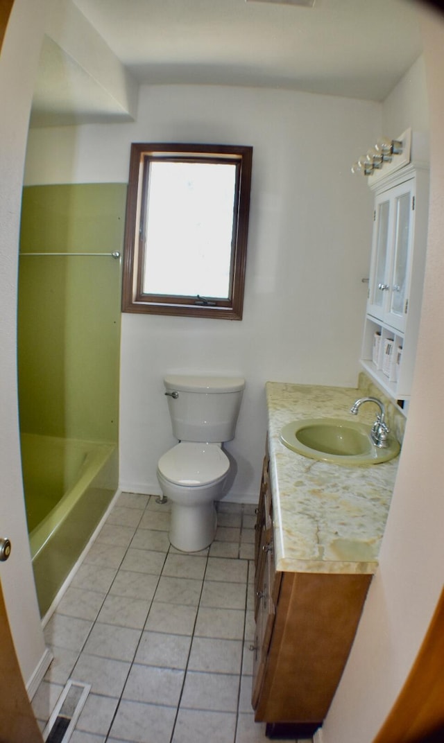 70 Dallion Ford Ln, Buffalo, MO 65622 - bathroom with toilet, tile patterned floors, vanity, a tub to relax in, and baseboards
