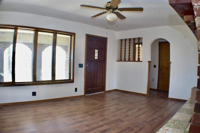 70 Dallion Ford Ln, Buffalo, MO 65622 - foyer with arched walkways, ceiling fan, wood finished floors, and baseboards