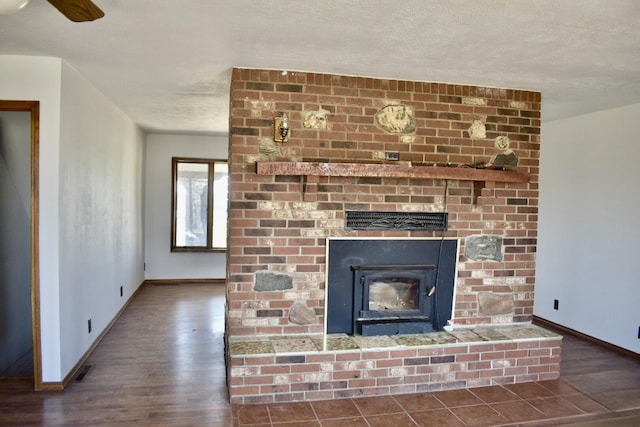 70 Dallion Ford Ln, Buffalo, MO 65622 - detailed view of wood finished floors, baseboards, a fireplace, and a ceiling fan