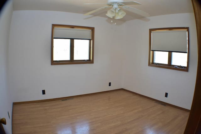 70 Dallion Ford Ln, Buffalo, MO 65622 - spare room featuring healthy amount of natural light, light wood finished floors, a ceiling fan, and baseboards