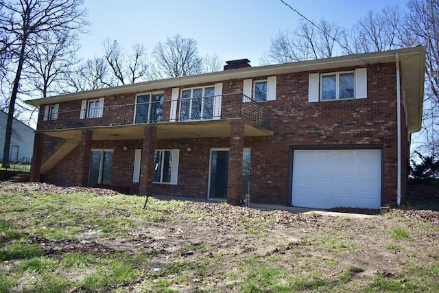 70 Dallion Ford Ln, Buffalo, MO 65622 - view of front of home featuring an attached garage, brick siding, and a chimney