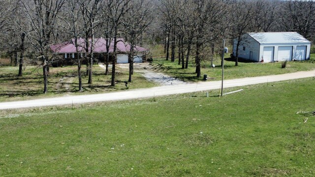 70 Dallion Ford Ln, Buffalo, MO 65622 - view of grassy yard with a detached garage and an outbuilding
