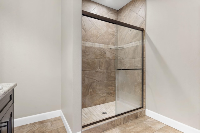311 Stillwood Dr, Branson, MO 65616 - full bath with a shower stall, baseboards, and vanity