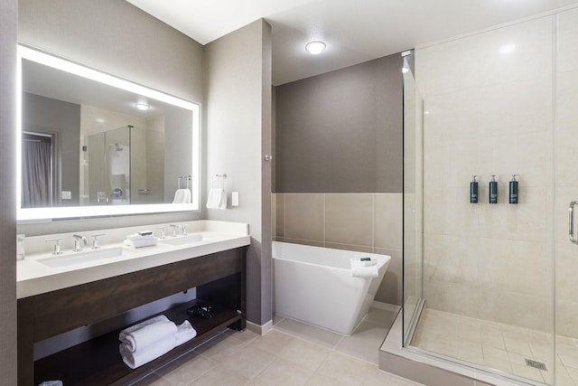 2513A Branson Landing Blvd, Branson, MO 65616 - bathroom featuring a stall shower, a soaking tub, tile patterned flooring, and double vanity