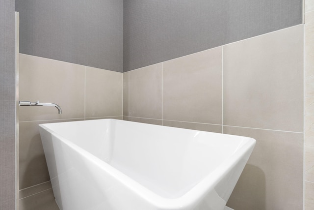 2513A Branson Landing Blvd, Branson, MO 65616 - full bath with a freestanding bath and tile walls