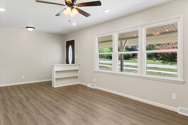 3156 N National Ave, Springfield, MO 65803 - spare room featuring wood finished floors, baseboards, ceiling fan, and recessed lighting