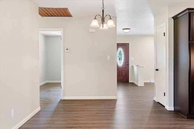 3156 N National Ave, Springfield, MO 65803 - entrance foyer featuring a chandelier, dark wood finished floors, and baseboards