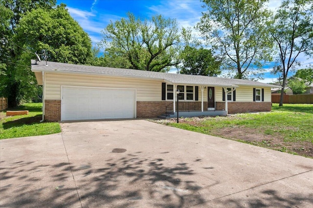 3156 N National Ave, Springfield, MO 65803 - ranch-style house with brick siding, a porch, and an attached garage