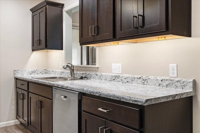 3156 N National Ave, Springfield, MO 65803 - kitchen featuring stainless steel dishwasher, a sink, dark brown cabinetry, and light countertops