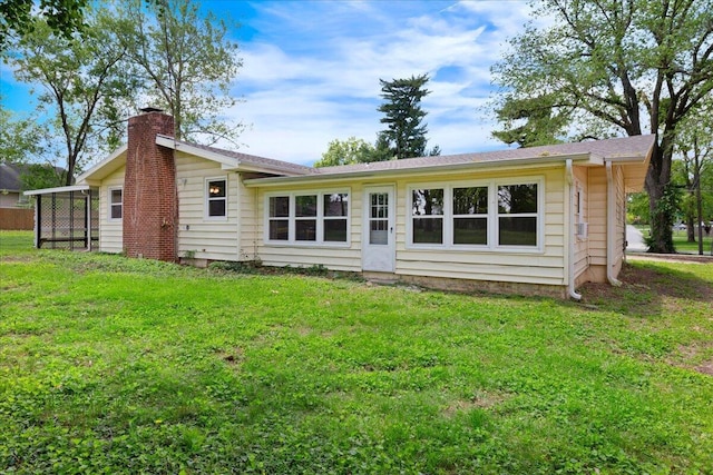 3156 N National Ave, Springfield, MO 65803 - rear view of house featuring a chimney and a lawn