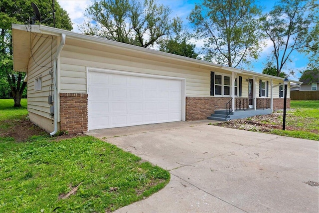 3156 N National Ave, Springfield, MO 65803 - single story home featuring brick siding, concrete driveway, a garage, and covered porch