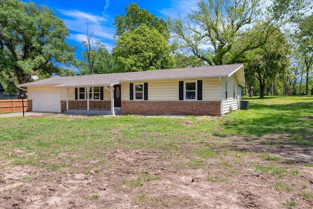 3156 N National Ave, Springfield, MO 65803 - ranch-style house featuring covered porch, an attached garage, brick siding, and concrete driveway
