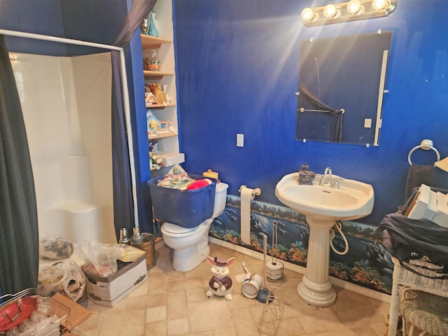 2016 Timberlake Rd, Branson, MO 65616 - bathroom with a shower stall, toilet, and baseboards