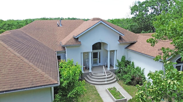 2016 Timberlake Rd, Branson, MO 65616 - view of front facade featuring stucco siding, roof with shingles, and a patio area