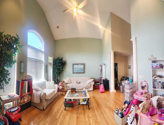 2016 Timberlake Rd, Branson, MO 65616 - living room featuring ornate columns, high vaulted ceiling, hardwood / wood-style flooring, and a ceiling fan