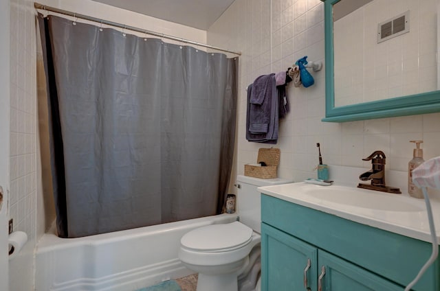 817 Kentland Dr, Neosho, MO 64850 - bathroom featuring tasteful backsplash, tile walls, toilet, shower / bathtub combination with curtain, and vanity