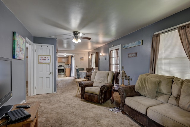720 Kentland Dr, Neosho, MO 64850 - carpeted living area with a ceiling fan