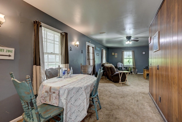 720 Kentland Dr, Neosho, MO 64850 - dining area with light carpet, ceiling fan, and baseboards