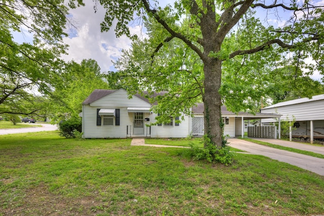 720 Kentland Dr, Neosho, MO 64850 - view of front of property with concrete driveway, a front yard, and an attached carport