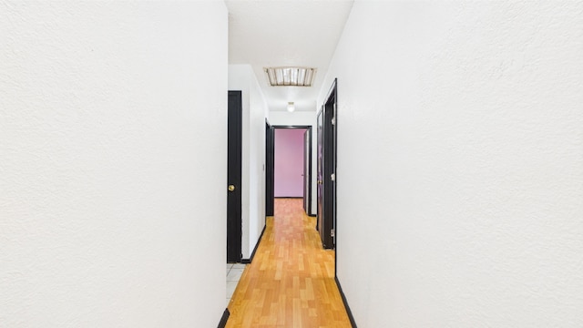 hall featuring light wood finished floors