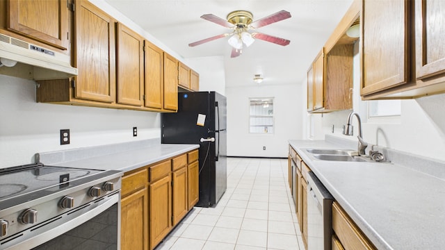 kitchen featuring electric range, a sink, freestanding refrigerator, dishwasher, and light tile patterned flooring