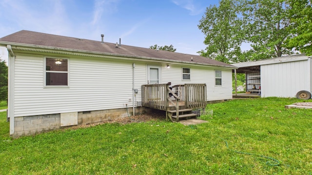 rear view of house with a yard, a deck, and crawl space