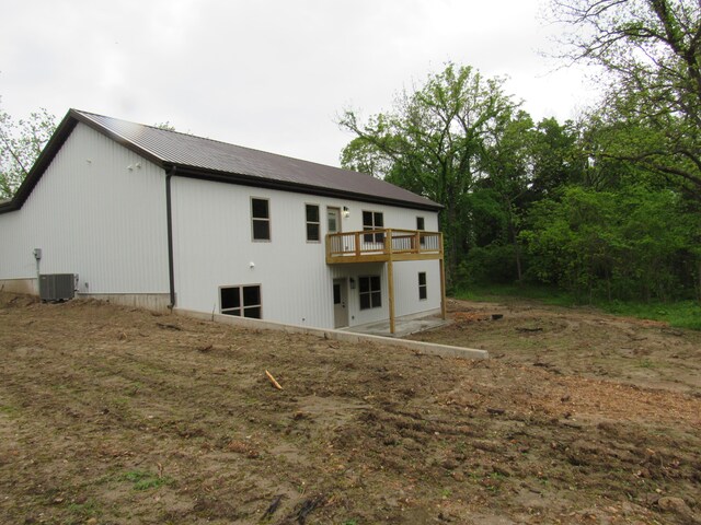 748 Birdsong Ln, Marshfield, MO 65706 - rear view of house with a deck, metal roof, and cooling unit