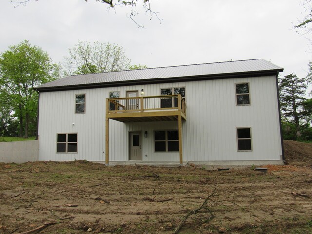 748 Birdsong Ln, Marshfield, MO 65706 - rear view of house with metal roof and a wooden deck