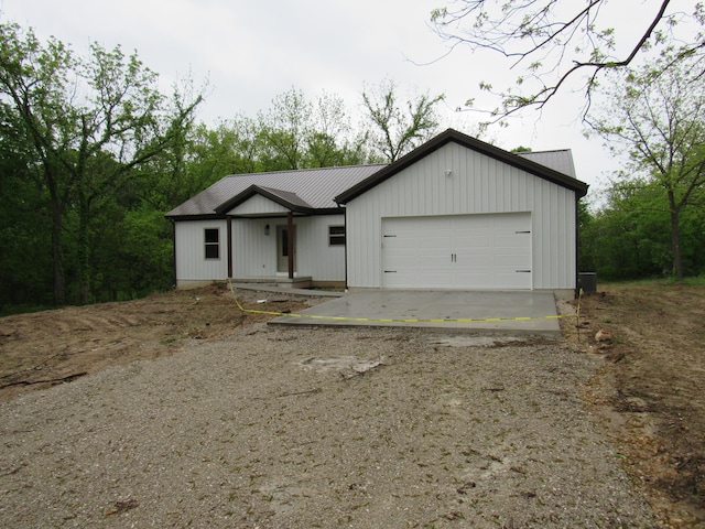 748 Birdsong Ln, Marshfield, MO 65706 - view of front of home with metal roof, driveway, and a garage