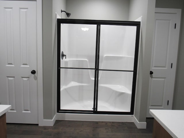 748 Birdsong Ln, Marshfield, MO 65706 - bathroom featuring vanity, a shower stall, wood finished floors, and baseboards