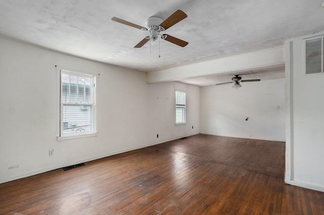 unfurnished room with ceiling fan, healthy amount of natural light, and wood-type flooring