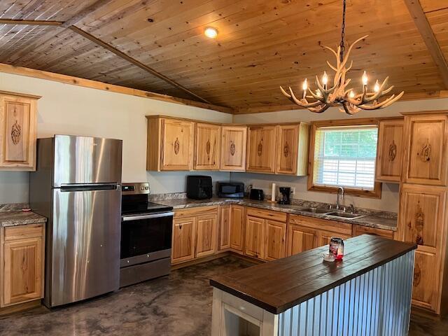 420 Maple St, Granby, MO 64844 - kitchen featuring stainless steel appliances, wood ceiling, a chandelier, light brown cabinetry, and butcher block counters