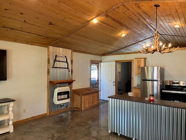 420 Maple St, Granby, MO 64844 - kitchen featuring appliances with stainless steel finishes, heating unit, concrete floors, wood ceiling, and a chandelier