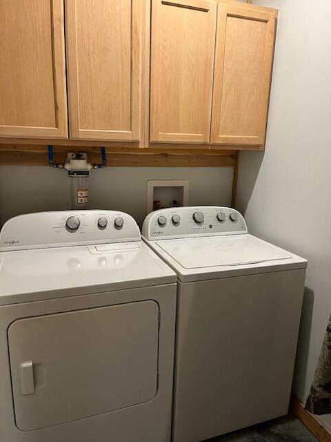 420 Maple St, Granby, MO 64844 - clothes washing area with cabinet space and washing machine and clothes dryer