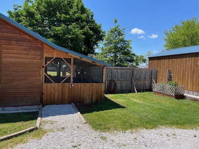 420 Maple St, Granby, MO 64844 - view of yard with an outbuilding and fence