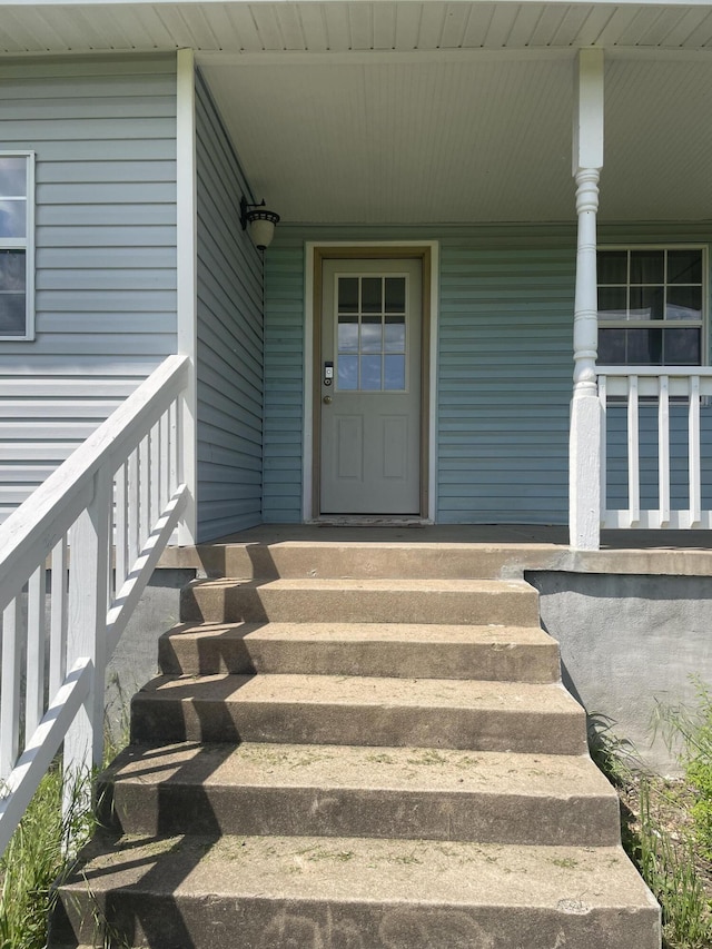 doorway to property with a porch