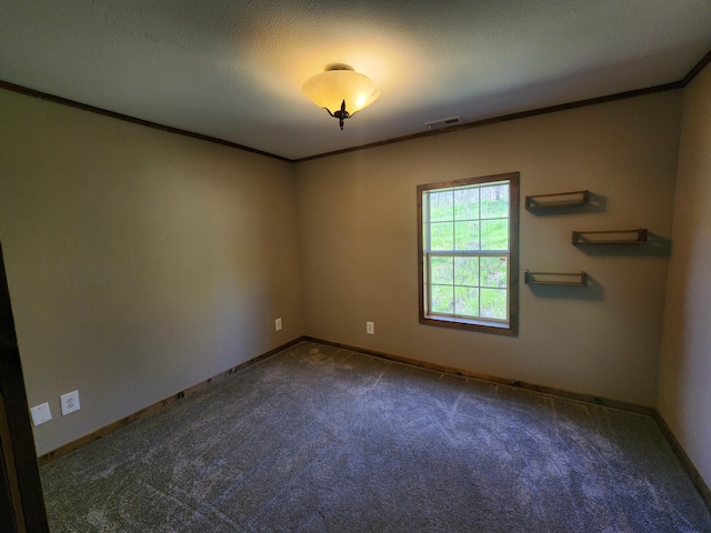 carpeted spare room featuring ornamental molding and baseboards